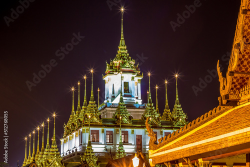 Night scene of Loha Prasat at Wat Ratchanaddaram Woravihara (buddhist temple located in Phra Nakhon district,Bangkok,Thailand. Also called the 'Metal Castle')