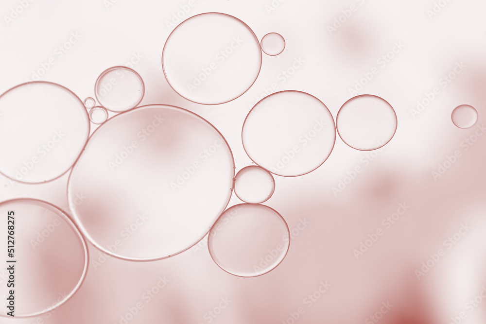 Oil and water droplets on rose pink background. Oil and water droplets on rose pink background.