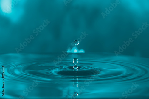 water droplets ,splash and rippled on blue-green colour background. 