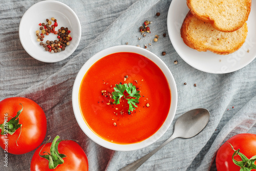 Top view bowl of tomato soup and toasted bread