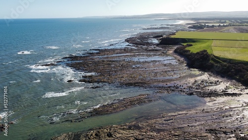 Aerial view of the sea and rocky coastline on the East coast of Scotland.  photo