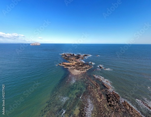 Aerial view of the sea and rocky coastline on the East coast of Scotland. 