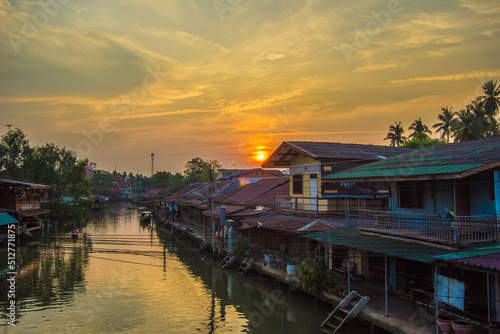 Amphawa district,Samut Songkhram Province,Thailand on April 13,2019:Sunrise in the morning at Amphawa Floating Market. © mickey_41