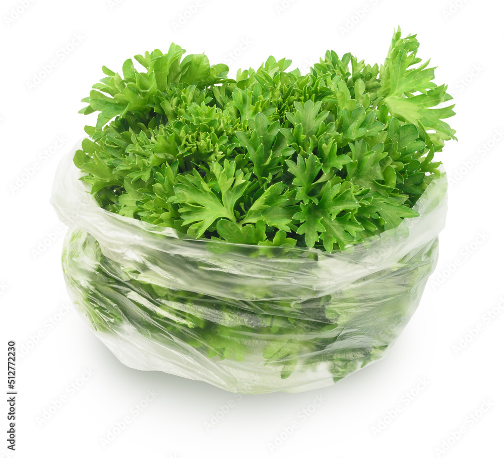 parsley in plastic bag isolated on white. greens grown in greenhouses. parsley in plastic bag isolated on white. greens grown in greenhouses.