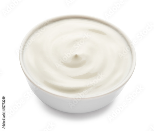 sour cream in a plate isolated on white background.