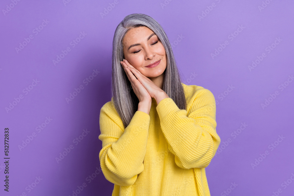 Photo of charming gorgeous mature lady sleeping dreaming about shopping isolated on purple color background