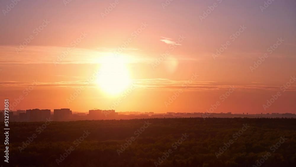 Sunset among the evening clouds. Red sun in the evening sky, timelapse Sunset among the evening clouds. Red sun in the evening sky, timelapse
