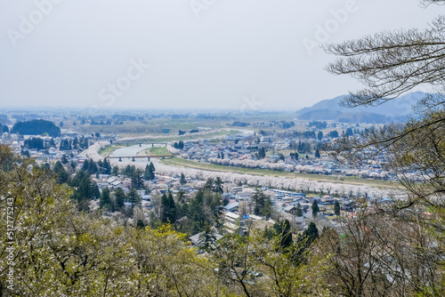 Akita,Tohoku,Japan:Panoramic view of Kakunodate town and the Hinokinaigawa River during cherry blossom festival as seen from the former site of Kakunodate Castle on the hilltop. © mickey_41