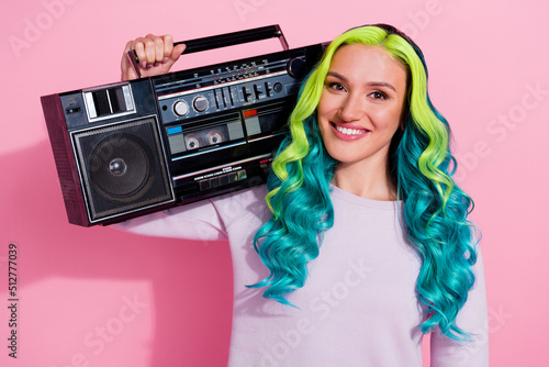 Photo of cheerful satisfied person carry vintage boombox shoulder isolated on pink color background