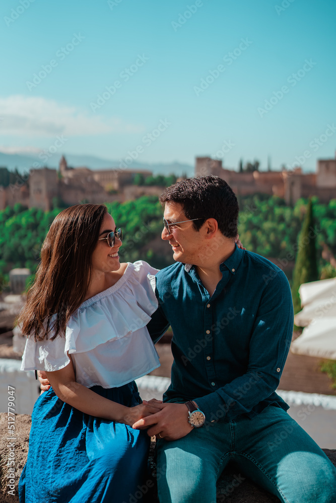 beautiful couple in love sitting with nice background