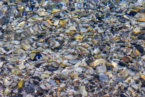 Pebbles in the water on the seashore