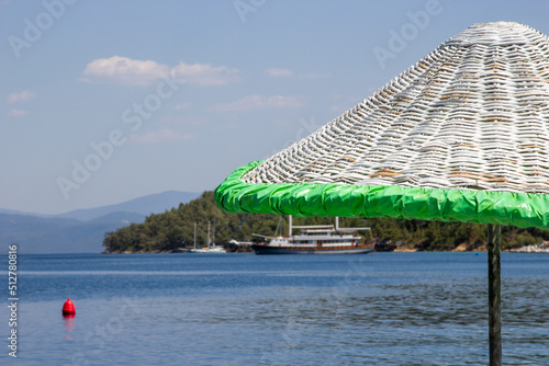 Sunbeds and umbrellas in the water on the beach