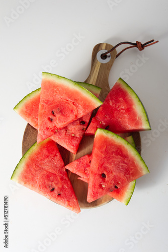 sliced watermelon on a wooden stand top view