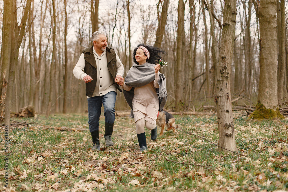 Elegant adult couple in a spring forest Elegant adult couple in a spring forest