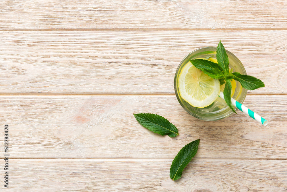 Caipirinha, Mojito cocktail, vodka or soda drink with lime, mint and straw on table background. Refreshing beverage with mint and lime in glass top view flat lay Caipirinha, Mojito cocktail, vodka or soda drink with lime, mint and straw on table background. Refreshing beverage with mint and lime in glass top view flat lay