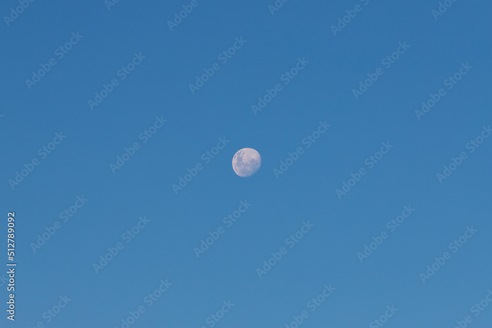 Waning gibbous moon on clear blue sky. Waning gibbous moon on clear blue sky.
