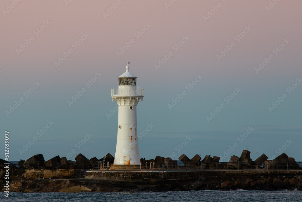 Breakwater Lighthouse at sunset time, Wollongong, Australia.
