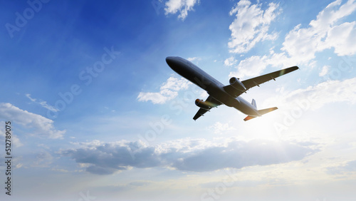 Airplane flying in the air with sunlight shining in blue sky background. Travel journey and Wanderlust transportation concept. 3D illustration rendering photo