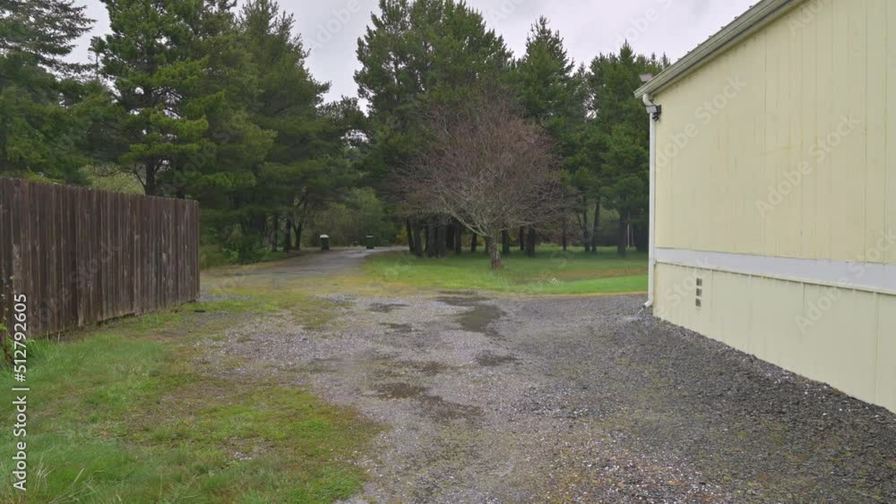 Generic yellow house with trees in a rain storm. Generic yellow house with trees in a rain storm.