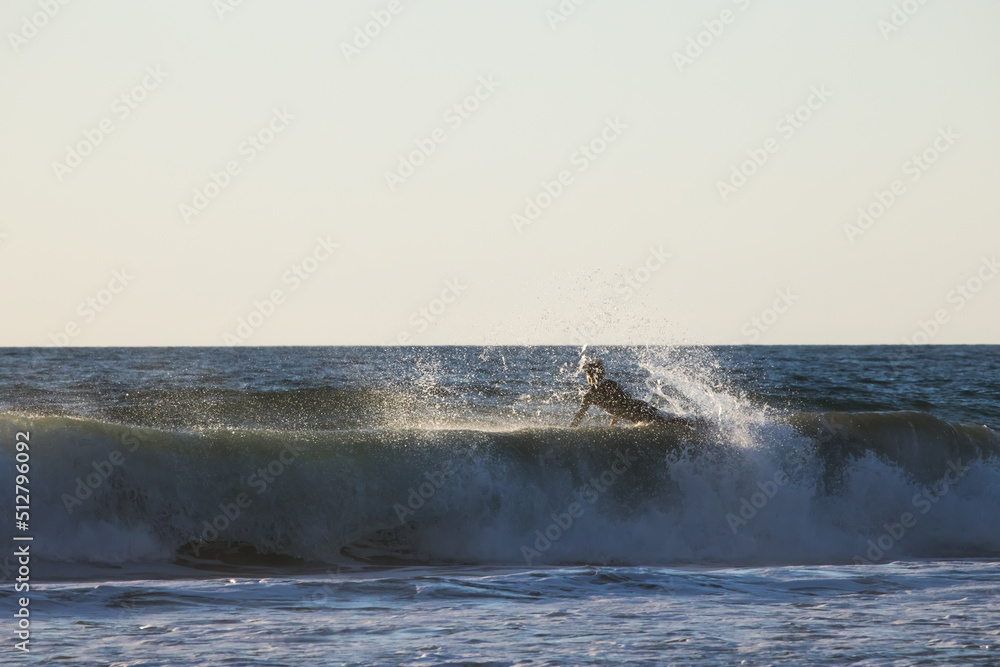 Surfing in the ocean waves