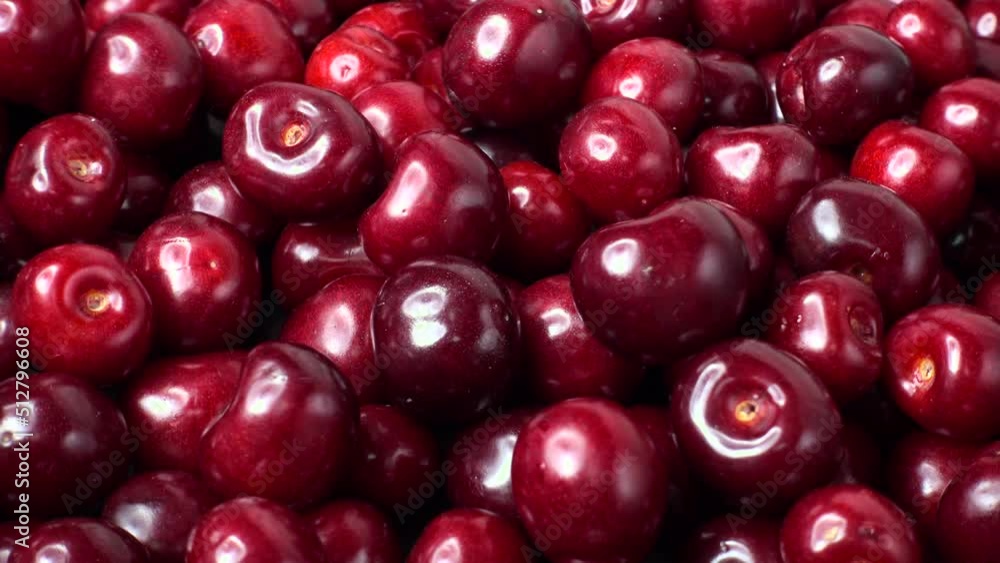 Fresh red Cherry rotate, closeup 4K video. Many juicy ripe berries Cherrys