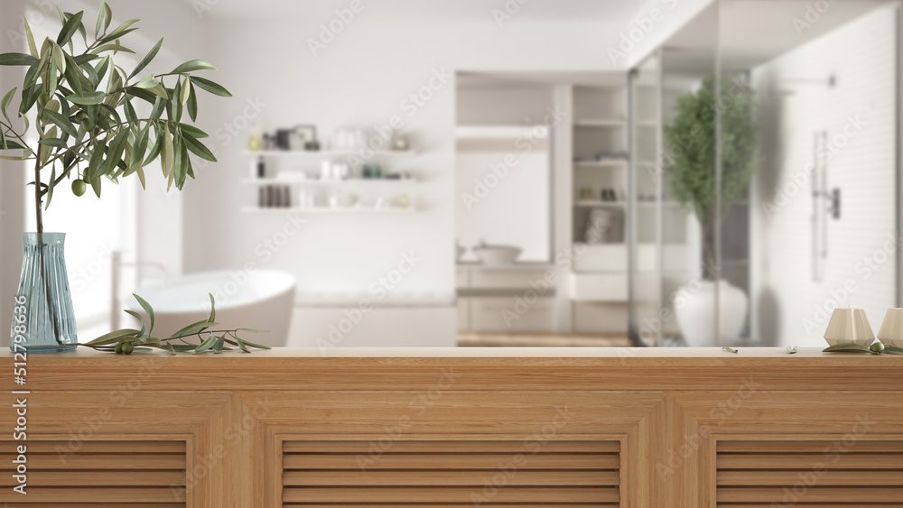 Wooden table top, cabinet, panel or shelf with shutters close up. Olive branch in vase and candles. Blurred background with modern bathroom with bathtub and shower, interior design Wooden table top, cabinet, panel or shelf with shutters close up. Olive branch in vase and candles. Blurred background with modern bathroom with bathtub and shower, interior design
