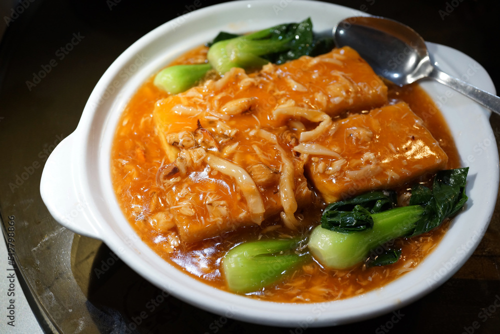 Deep fried tofu with braised crabmeat thick sauce. Traditional Chinese food. Deep fried tofu with braised crabmeat thick sauce. Traditional Chinese food.