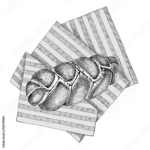 Fresh homemade braided egg bread on towel