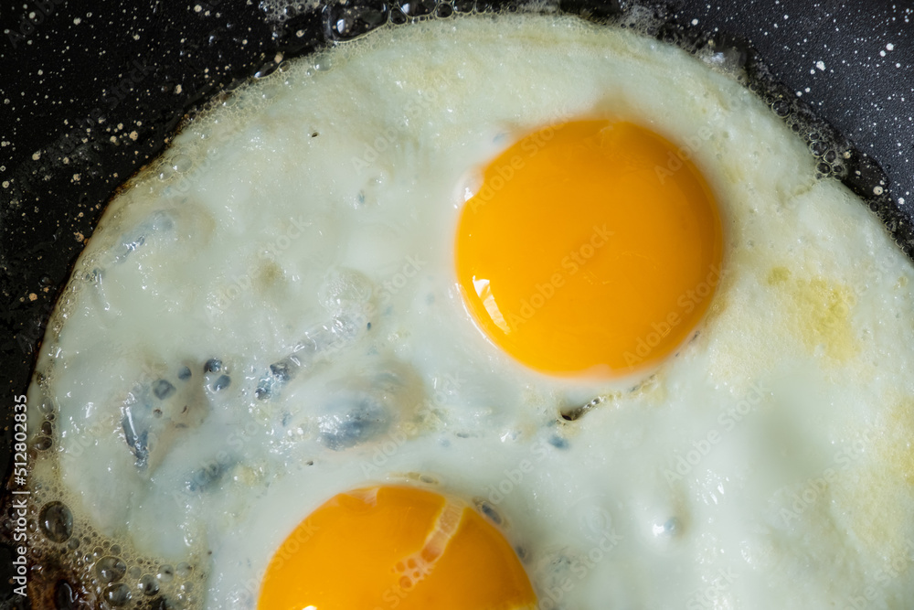 Fried eggs from two eggs. View from above. Fried eggs, delicious food. Fried eggs from two eggs. View from above. Fried eggs, delicious food.