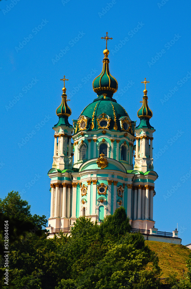 Detailed view of ancient Saint Andrew's Church against blue sky, summer sunny morning. Architectural icon of the city of Kyiv. Christian Orthodox cathedral. UNESCO World Heritage Site