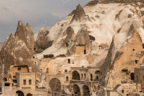 typical houses on the rocks in the city of Cappadocia, Turkey, on a cloudy day, in winter.