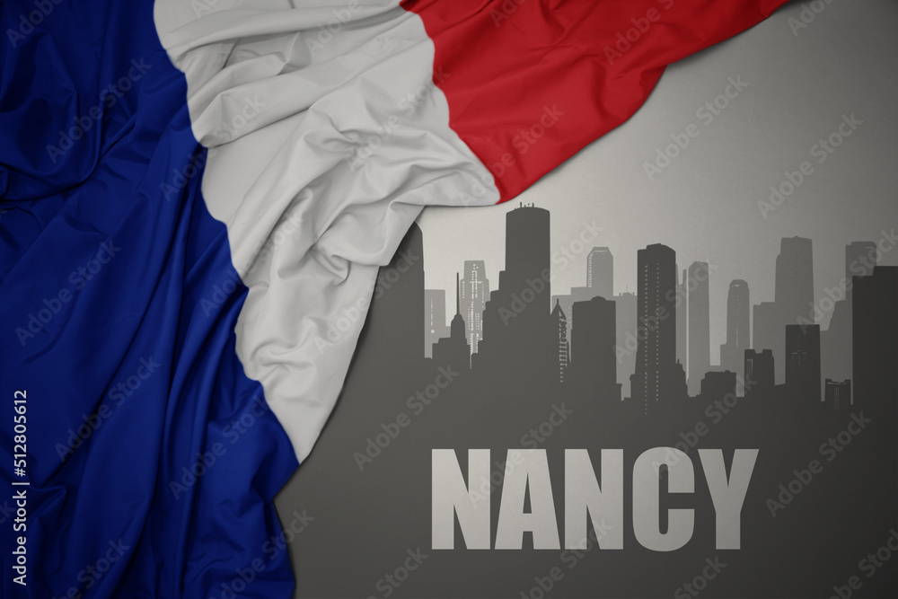 abstract silhouette of the city with text Nancy near waving national flag of france on a gray background.