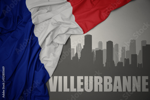 abstract silhouette of the city with text Villeurbanne near waving national flag of france on a gray background.