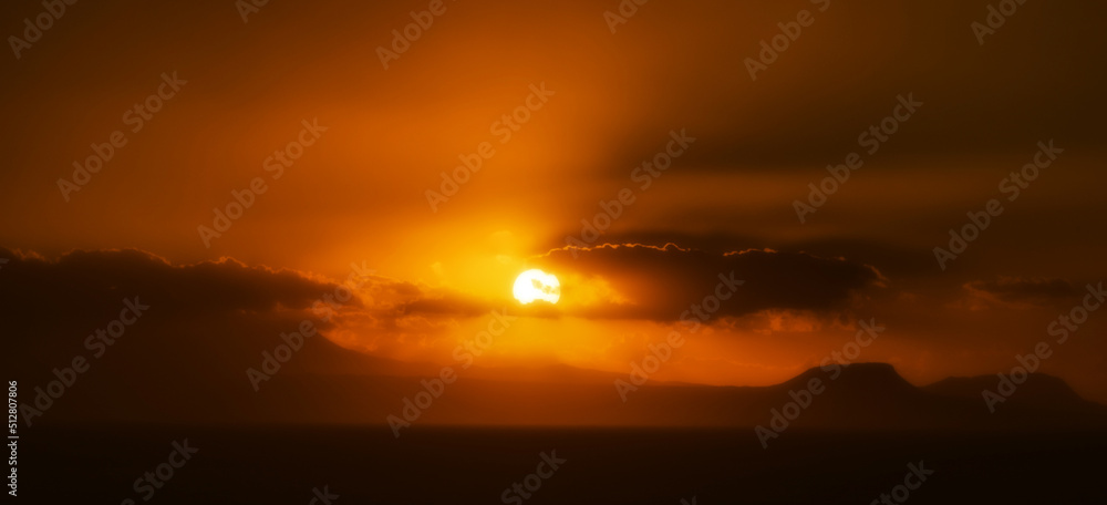 Sunset and silhouette of mountains