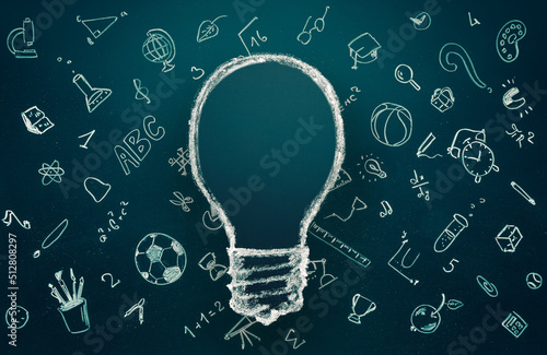 idea and eduction concept. Light bulb with hand drawn school doodle icons. Studying, knowledge, learning idea.