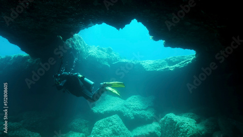 Scuba diver photographer swim in the cave. Cave diving in Mediterranean Sea, Cyprus © Andriy Nekrasov