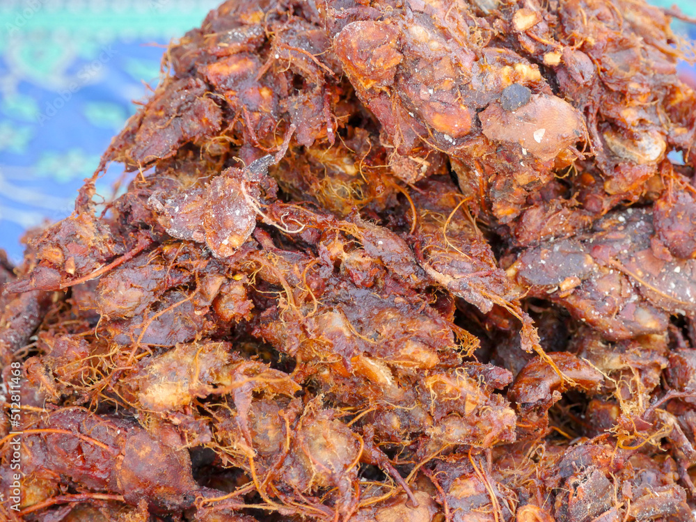 Heap of Tamarind imli selling in Indian shop as spice. Tamarind known as Imli in India is a widely used spice-condiment in India.