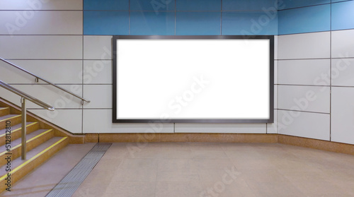 Horizontal mock up of blank advertising billboard poster template next to a flight of stairs; out-of-home OOH media display space mockup in pedestrian underpass; digital display in train station.