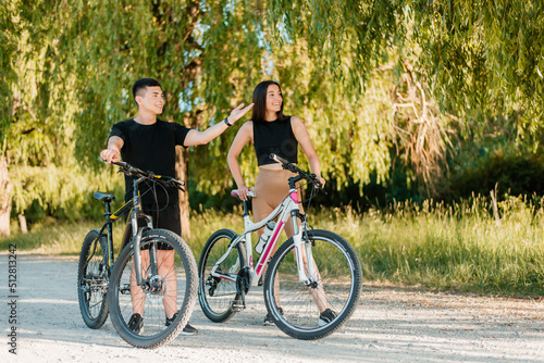 Couple on bicycles in the park