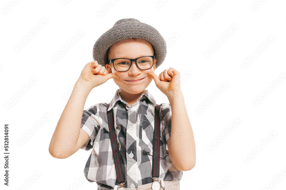 Portrait of cute little boy, happy kid in eyeglasses and hat isolated on white studio background with copyspace for ad. Retro vintage style concept Portrait of cute little boy, happy kid in eyeglasses and hat isolated on white studio background with copyspace for ad. Retro vintage style concept