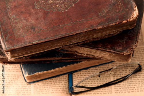 Obraz na płótnie Old worn shabby leather-bound jewish books on open blurred Torah in the background. Closeup. Selective focus. w salonie