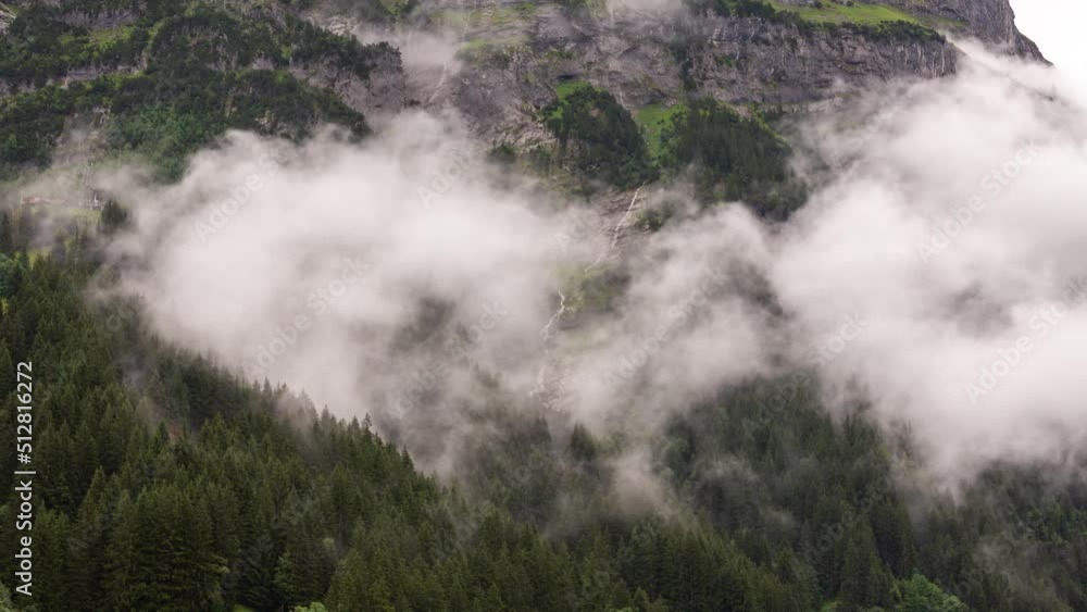 Timelapse of low clouds over a forest at Mettenberg in Grindelwald Timelapse of low clouds over a forest at Mettenberg in Grindelwald