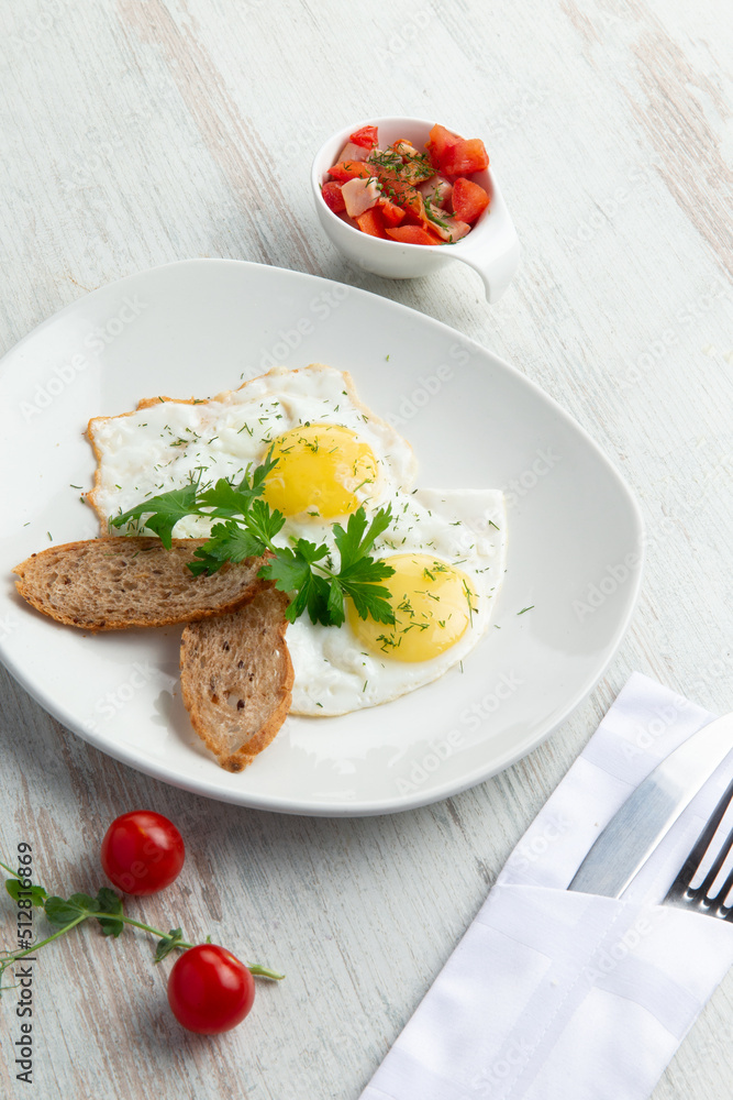 Fried eggs and and croutons in a plate