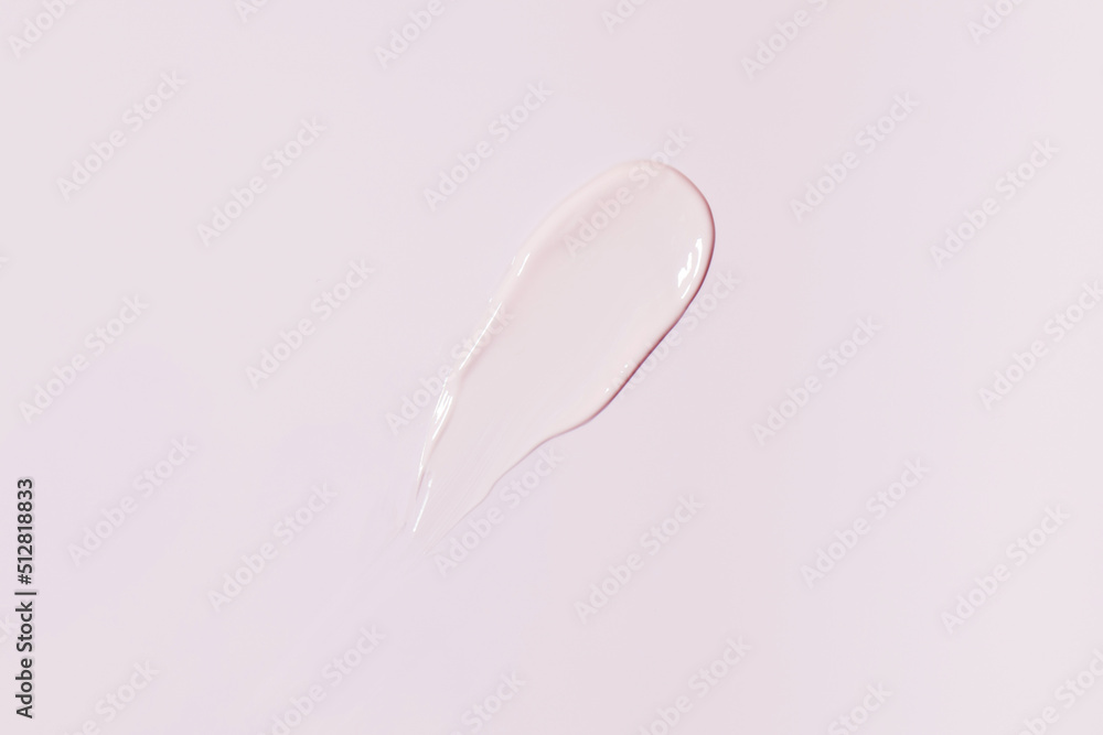 A smear of pink cosmetics on a pink background. A sample for advertising, a skin care concept. A smear of pink cosmetics on a pink background. A sample for advertising, a skin care concept.