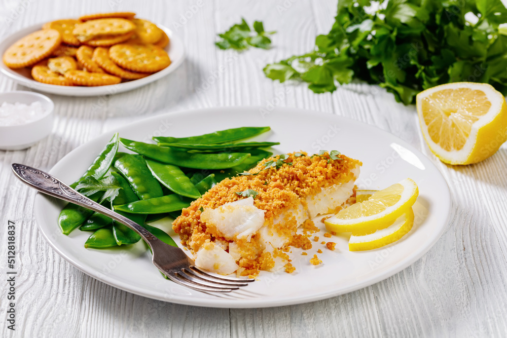 Baked Cod with Crackers toppings and snow peas