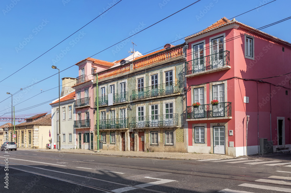Old beautiful houses with balconies on Rua da Junqueira or Junqueira street. Lisbon, Portugal