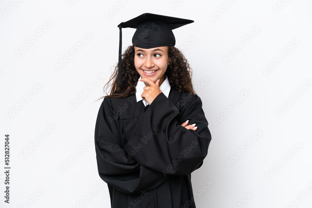 Young university graduate Arab woman isolated on white background looking to the side Young university graduate Arab woman isolated on white background looking to the side
