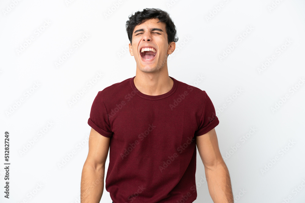 Young Argentinian man isolated on white background shouting to the front with mouth wide open Young Argentinian man isolated on white background shouting to the front with mouth wide open