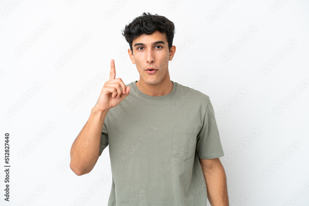 Young Argentinian man isolated on white background intending to realizes the solution while lifting a finger up Young Argentinian man isolated on white background intending to realizes the solution while lifting a finger up