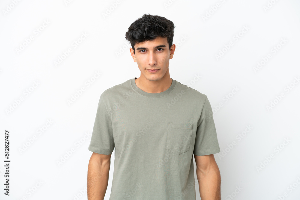 Young Argentinian man isolated on white background with sad expression Young Argentinian man isolated on white background with sad expression